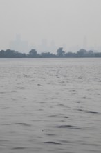 Detroit, Michigan USA - 4 August 2025 - Smoke from Canadian wildfires nearly erases the downtown