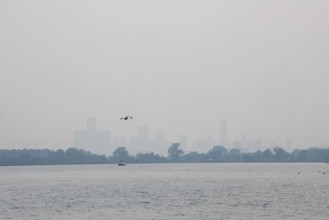 Detroit, Michigan USA - 4 August 2025 - Smoke from Canadian wildfires nearly erases the downtown