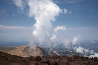 Colorado Springs, Colorado - Clourds rise near the summit of Pikes Peak, a 14, 115' mountain in