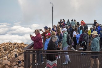 Colorado Springs, Colorado - Tourists on a viewing platform on Pikes Peak, a 14, 115' mountain in