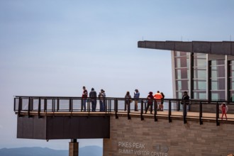 Colorado Springs, Colorado - Tourists on the viewing platform at the Pikes Peak Summit Visitor