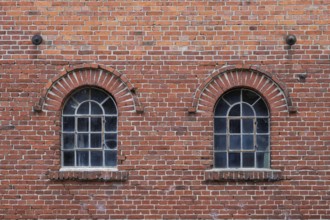 Old windows in a traditional brick wall with rustic charm and visible reflections, Stiftsmühle,