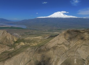 Snow-covered mountain under a clear blue sky with a vast landscape in the foreground, Great Ararat,