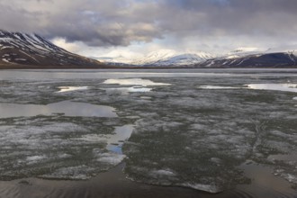 Ice on water, frozen lake, Aventdalen, Longyearbyen, Spitsbergen, Svalbard