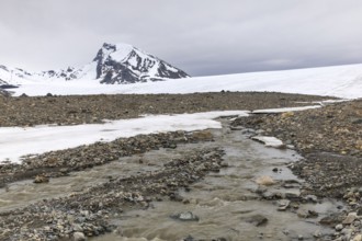 Melting glacier, stones, water, mountain peak, Cooper Camp, Spitsbergen, Svalbard