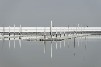 Winter day, onset of winter, snow on the jetties in the marina, North Sea, Norddeich, Lower Saxony,