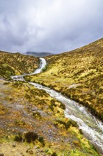 Eas a' Bhradain waterfall, Red Cuillin mountains, Loch Ainort, Isle of Skye, Scotland, UK