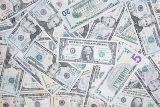 Various US dollar notes in a pile, banknotes