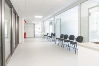 Modern and bright corridor with waiting area and glass walls, Care Connect, vaccination kiosk for