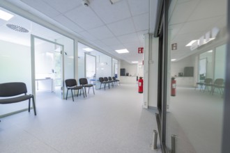 Corridor with several chairs for waiting room, modern design, Care Connect, vaccination kiosk for