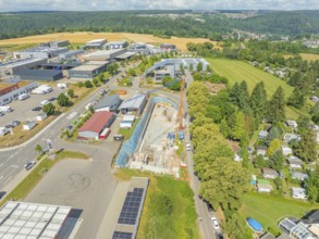Aerial view of a construction site in a rural industrial landscape, car park construction, Calw,