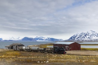 Historic steam locomotive, coal transport railway, mountain scenery, Ny-Alesund, Spitsbergen,