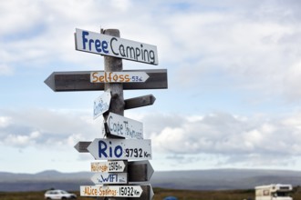 Signposts, signs, free camping, free WIFI, distance to Selfoss, Cape Town, Rio and Alice Springs,