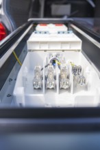 Close-up of electrical connections in a housing, assembly of a charging station for electric cars,
