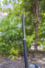 Single cable, insulated, protruding in natural surroundings, installation of a charging station for