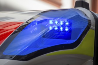 Close-up of a flashing blue light on an ambulance