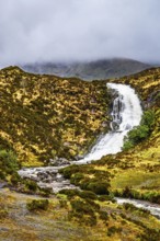 Eas a' Bhradain waterfall, Red Cuillin mountains, Loch Ainort, Isle of Skye, Scotland, UK