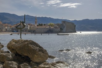 Statue of a ballerina against the background of the old town centre of Budva, Montenegro, Balkans