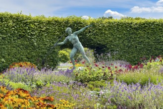 Sculpture Statue of bronze javelin thrower from 1937 by sculptor and artist Ernst Seger in flower