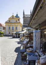 Souvenir shops at Kapellplatz with St Magdalena's Church, place of pilgrimage, Altötting, Upper