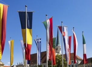National flags at Kapellplatz with the collegiate parish church of St Philip and St James, place of