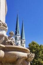 Marienbrunnen fountain on Kapellplatz with St.Philippus and Jakobus collegiate parish church, place
