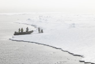 Zodiac with guides lands, Ice Edge, Sea, Spitsbergen, Svalbard