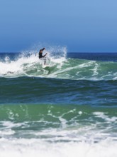 Surfer riding a wave on Contis beach, Saint Julien en Born, Saint-Julien-en-Born, Landes, France