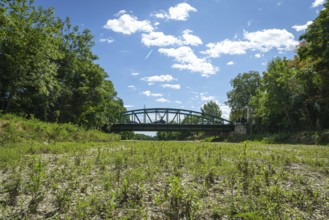 Bridge spans dry riverbed of the Schwarza, surrounded by trees, Neunkirchen, Lower Austria, Austria