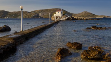 A narrow pier leads to a small church on a rock surrounded by the sea, chapel, church, Agios