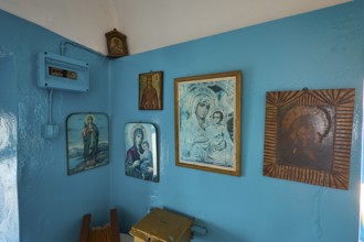 A room decorated with icons and blue-painted walls inside the church, chapel, church, Agios
