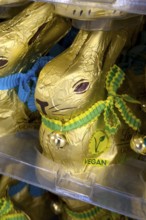 Chocolate bunny chocolate Easter bunny with button marking VEGAN award made from vegan chocolate,