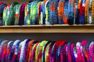 Colourful woolen hats on the shelf, Christmas market, city of Esslingen, district of Esslingen,