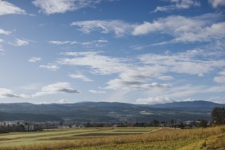Wide fields and hills under a vast sky with loose clouds, Ternitz, Lower Austria, Austria