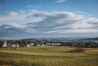 Panorama with city, fields and mountains under variable sky, Ternitz, Lower Austria, Austria