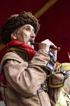 Flute player, musician, medieval clothing, medieval market, city of Esslingen, district of