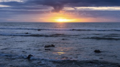 Sea in the evening at sunset, west coast of the Taranaki region, North Island, New Zealand
