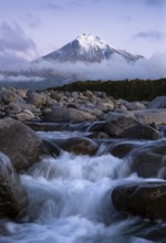 Mount Taranaki in the evening after sunset, in the foreground Stony River (Hangatahua River) .