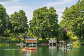 Carwitz Lake with paddlers and boathouses, Feldberger Seenlandschaft, Mecklenburg Lake District,