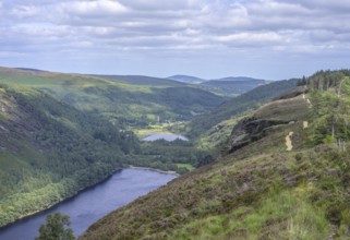 Upper Lake behind Lower Lake and round tower, Wicklow Mountains National Park, Glendalough,