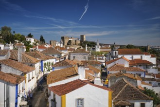 Stunning aerial view of Obidos, a medieval town in Portugal, showcasing its castle, city walls, and
