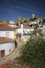 Charming town of Obidos with its medieval castle, ancient city walls, and picturesque rooftops.