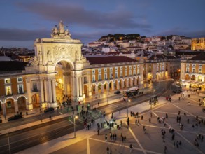 Experience the magic of Christmas in Lisbon as Praca do Comercio glows with festive lights in the