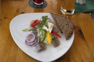 Fish platter with brown bread served in a harbour restaurant, Ahrenshoop, DarÃŸ,
