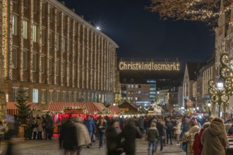 Entrance to the illuminated Nuremberg Christmas Market, with City Hall and the Beautiful Fountain,