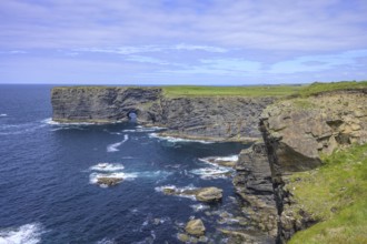 Cliff coast with rock arch, Kilkee, County Clare, Ireland