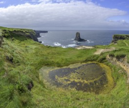 Rock nose in the sea called Candle Stick, Kilkee, County Clare, Ireland