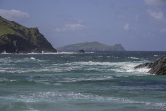 Waves crashing against cliffs in the background Inishtooskert Island (sleeping Giant), Clogher