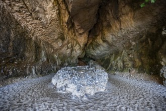 Stone men in a rock cave on the beach at Cala Luna, Golfo di Orosei, Baunei, Sardinia, Italy