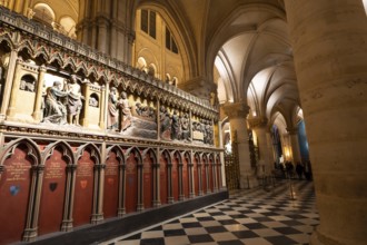 Notre dame cathedral interior with ornate gothic choir screen of detailed biblical sculptures,